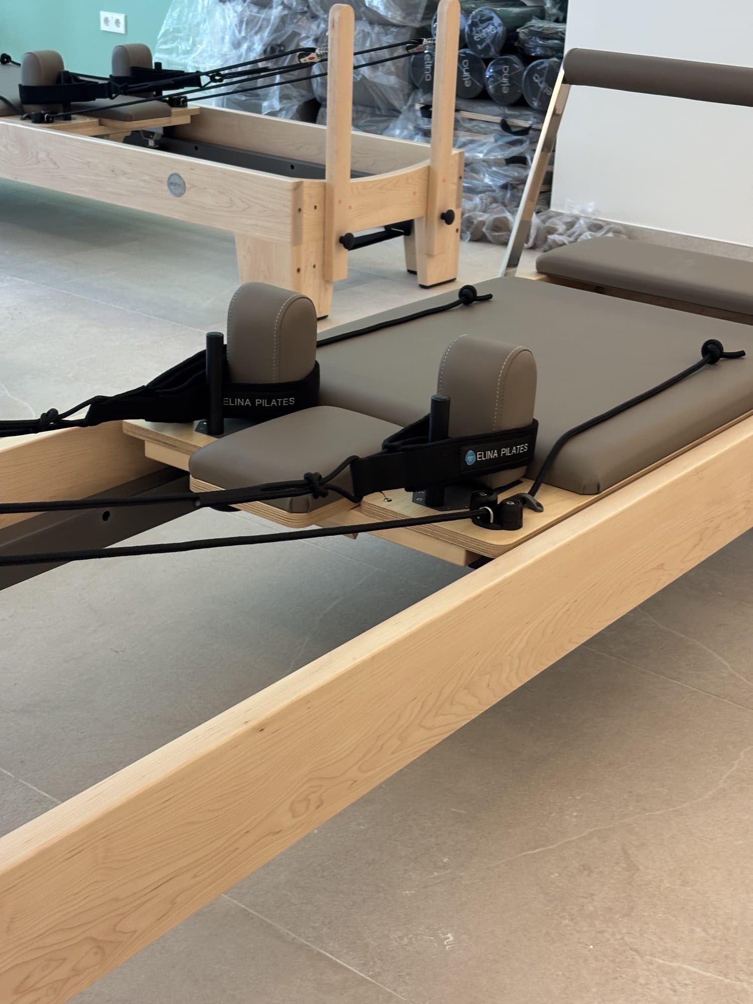 Carriage, shoulder rests, and footstraps on an Elina Pilates Elite Reformer