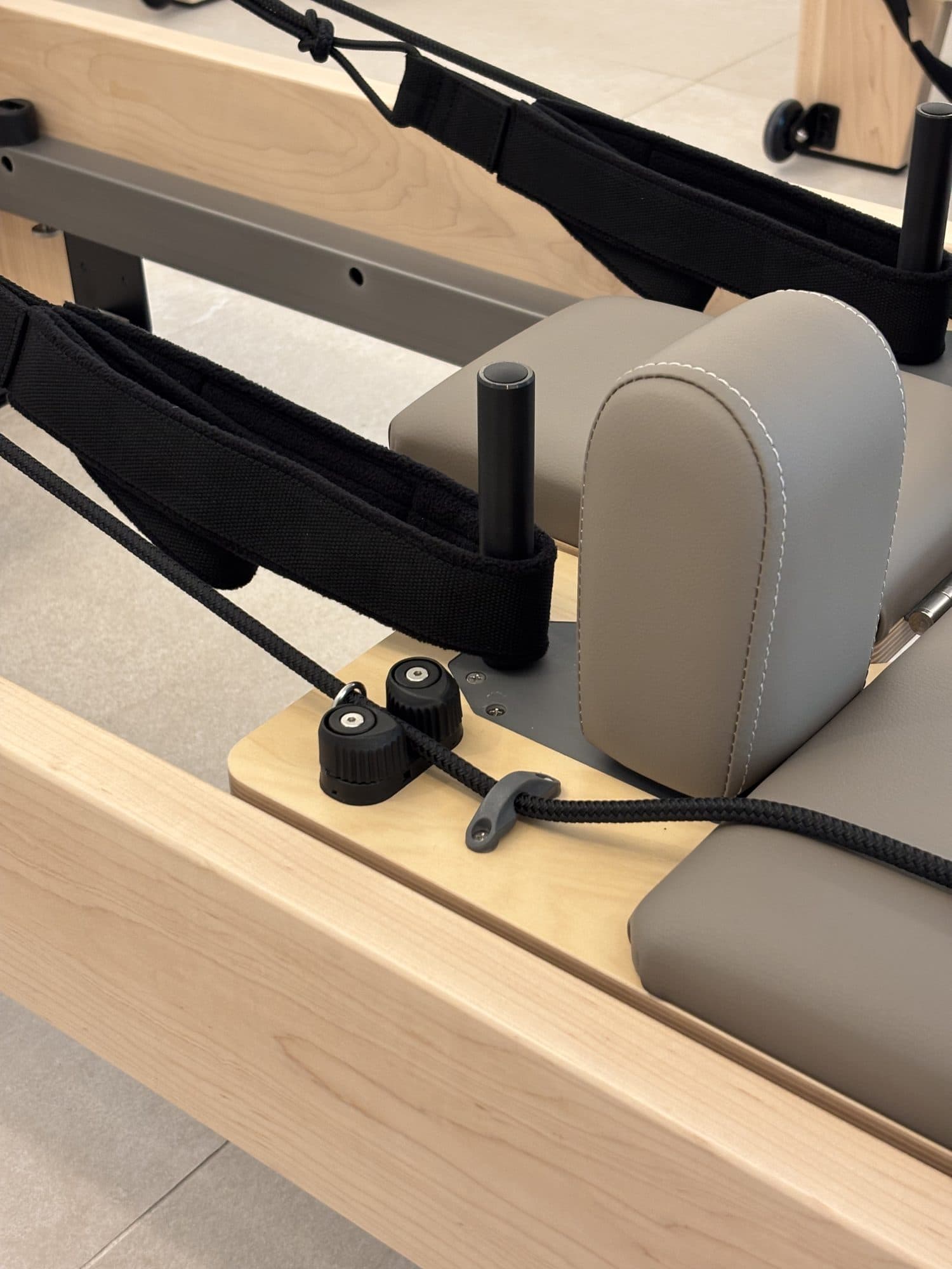 Handles, ropes, and cleats at the head of an Elite Reformer